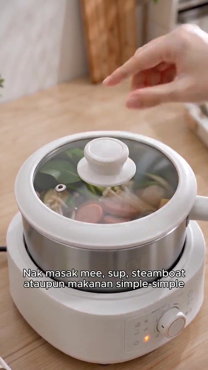 Hotpot ingredients being cooked in a home kitchen